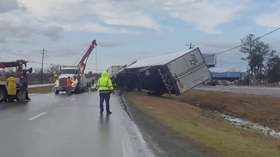 Overturned semi-truck is set upright in northern Alabama