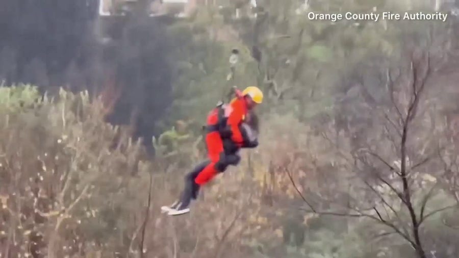 Watch: Woman rescued after climbing tree to escape fast moving floodwaters in California