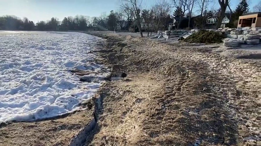 Watch: Low ice cover on Lake Erie beach reveals sand and shells