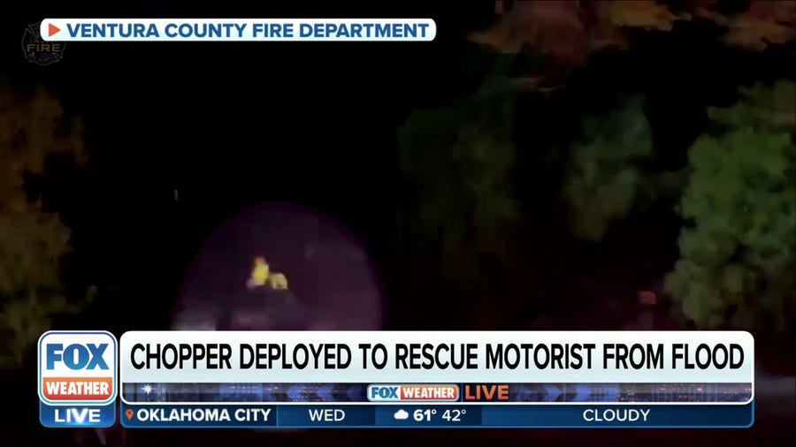 California fire crew rescues driver from floodwaters