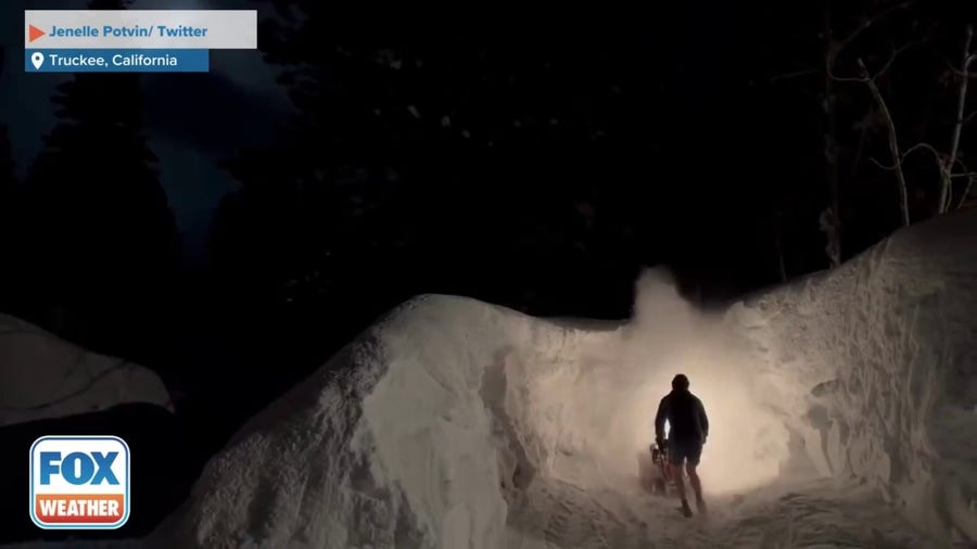California man attempts to clear massive piles of snow with snow blower