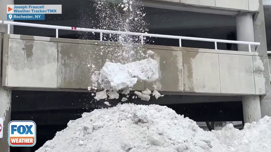 Bulldozer dumps snow off Rochester, NY building ahead of nor'easter