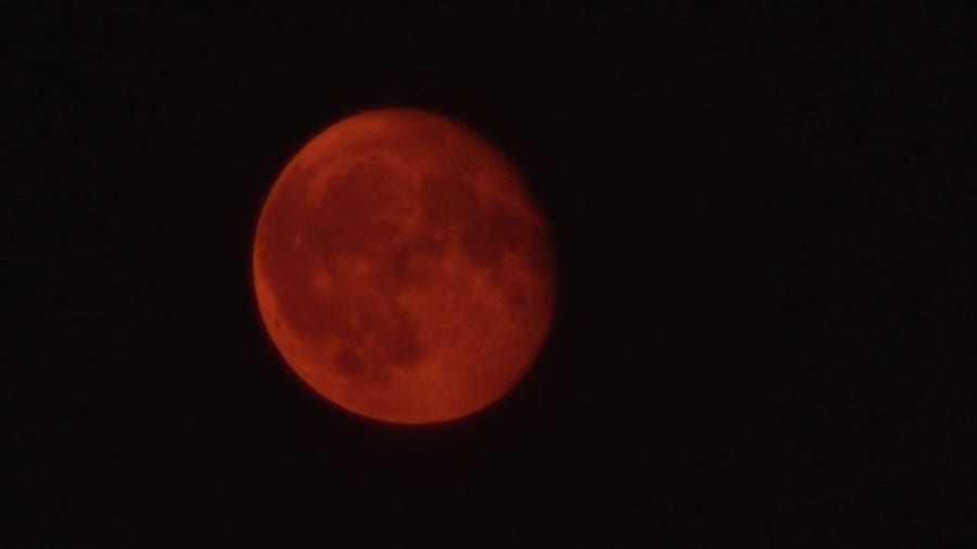 Smoky red moon rises over Philadelphia