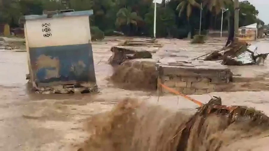 Deadly flooding in Haiti cuts off access to roads in Leogane
