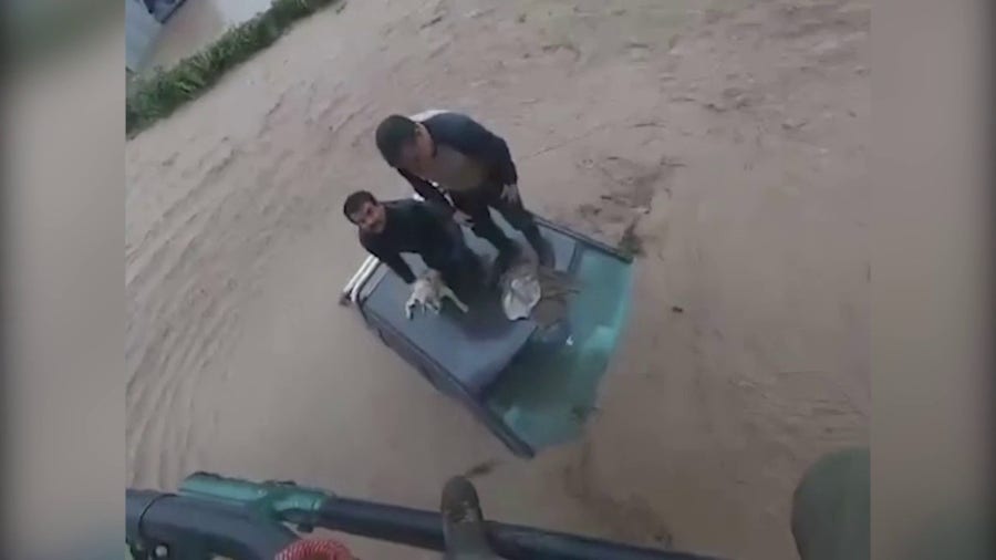 2 men, dog rescued by helicopter from floodwater in Chile