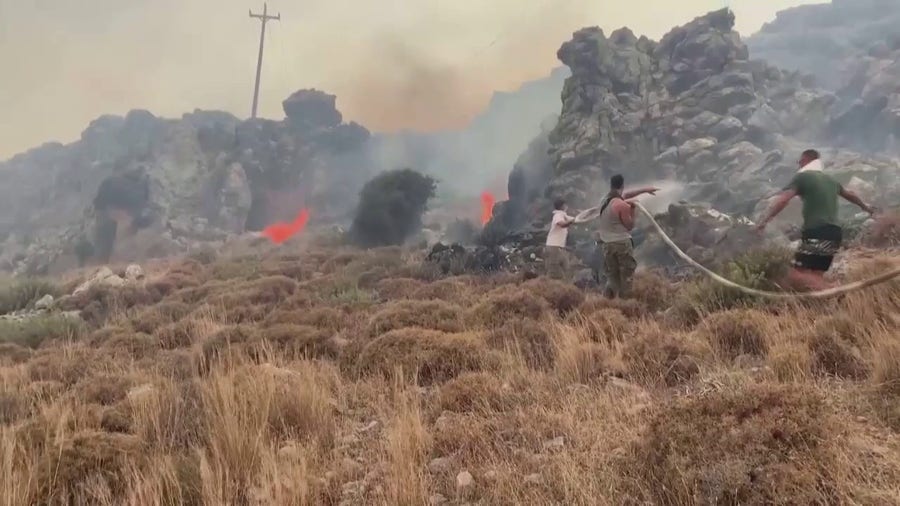 Watch: Crews battle large wildfire on Greek island of Rhodes