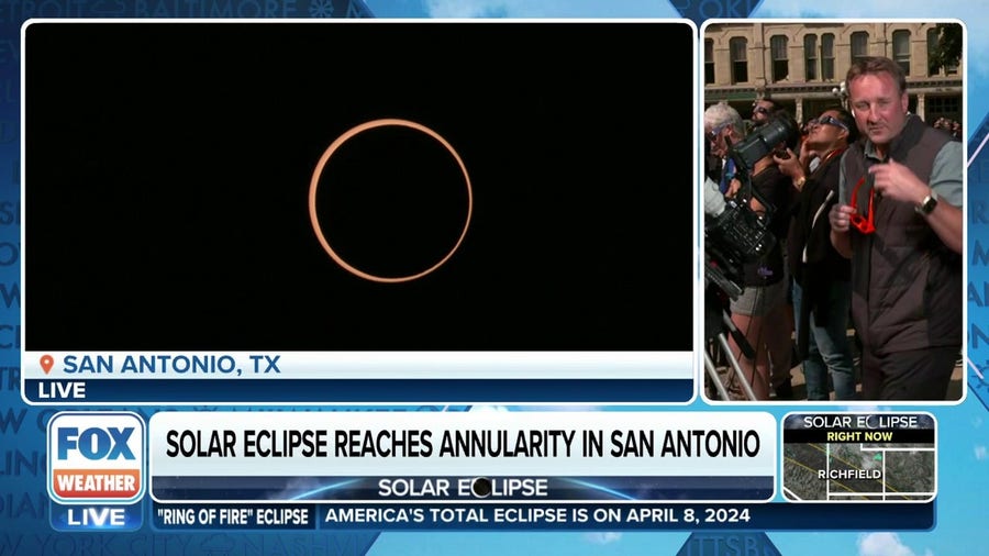 Skygazers in San Antonio cheer during annular solar eclipse