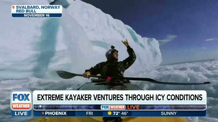Extreme kayaker ventures through icy conditions
