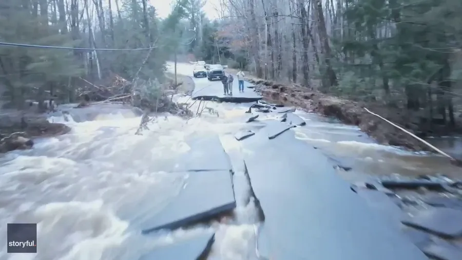 Road washed out after torrential rain in Maine