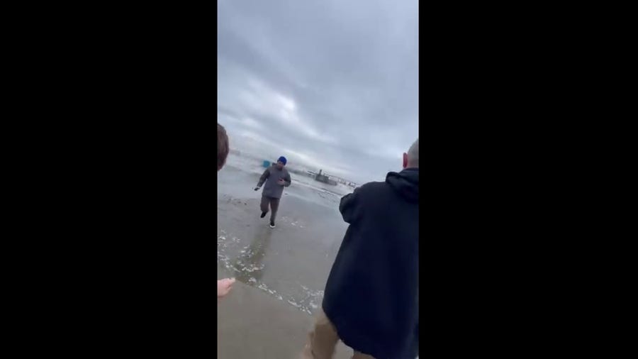 Watch: Onlookers run from surprisingly large wave