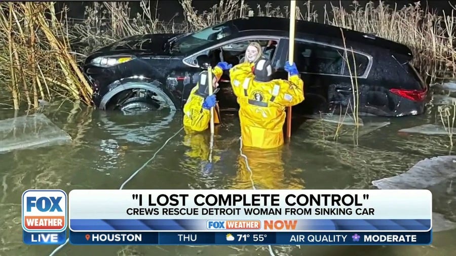 Firefighters rescue woman from sinking car in Michigan