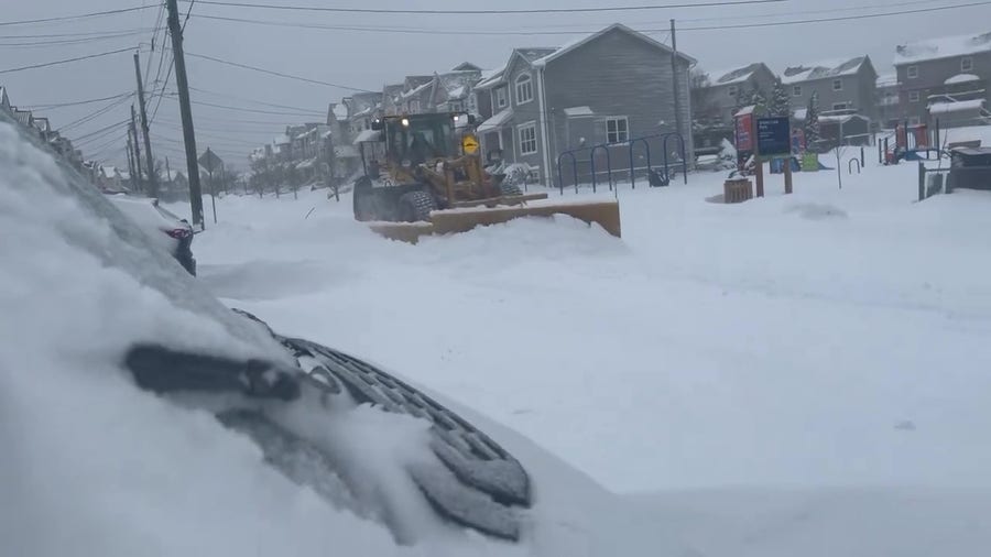 Snow plows clear more than a foot of snow that fell across Halifax, Nova Scotia