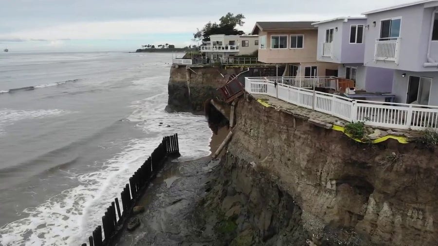 Watch: Walkways hang off cliff after bluff erodes beneath them