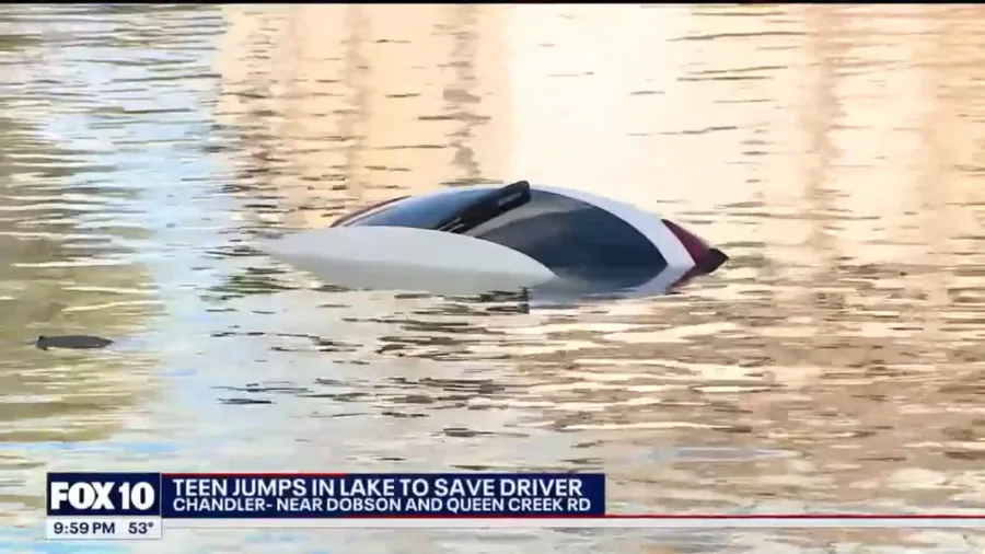 Teen jumps into cold lake to try and rescue driver