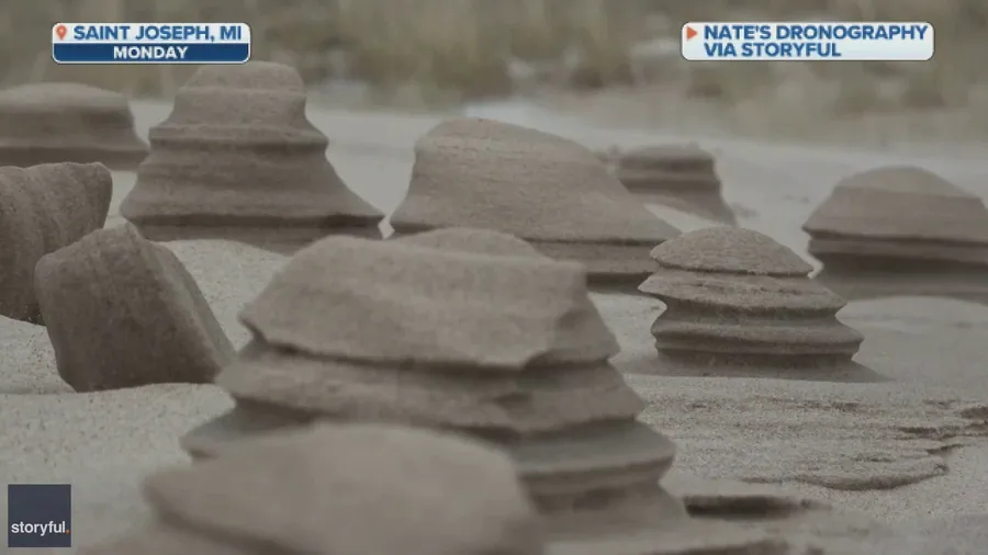 Last winter blast carves sand pillars in Michigan beach