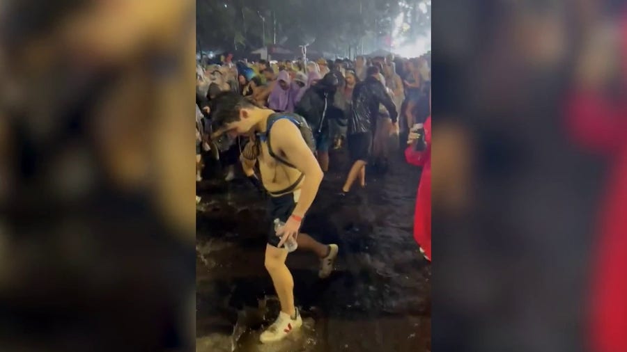 Watch: Miami Ulta Music Festival attendees slug through pouring rain as stormy weather forces temporary closure