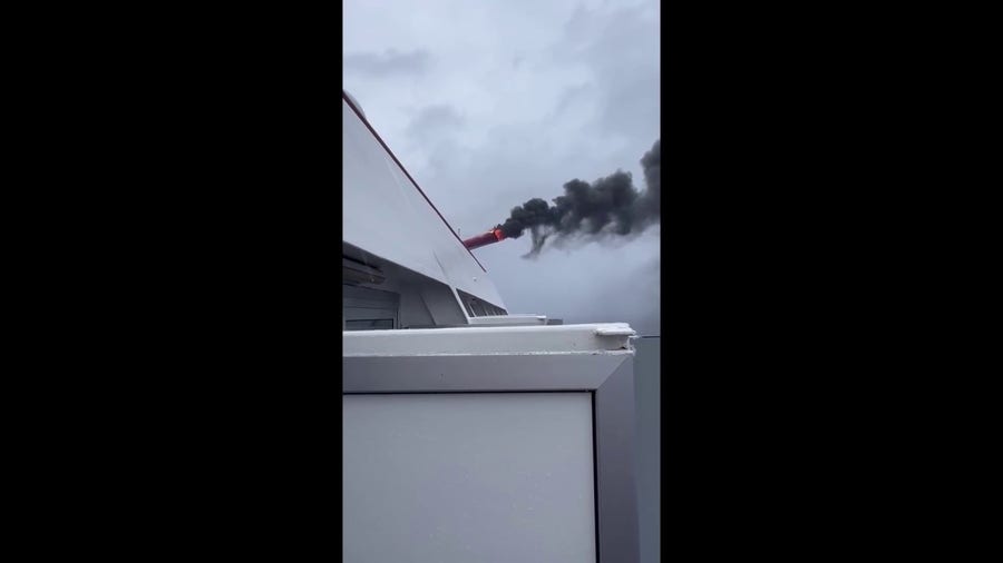 Carnival cruise ship catches fire during storm at sea