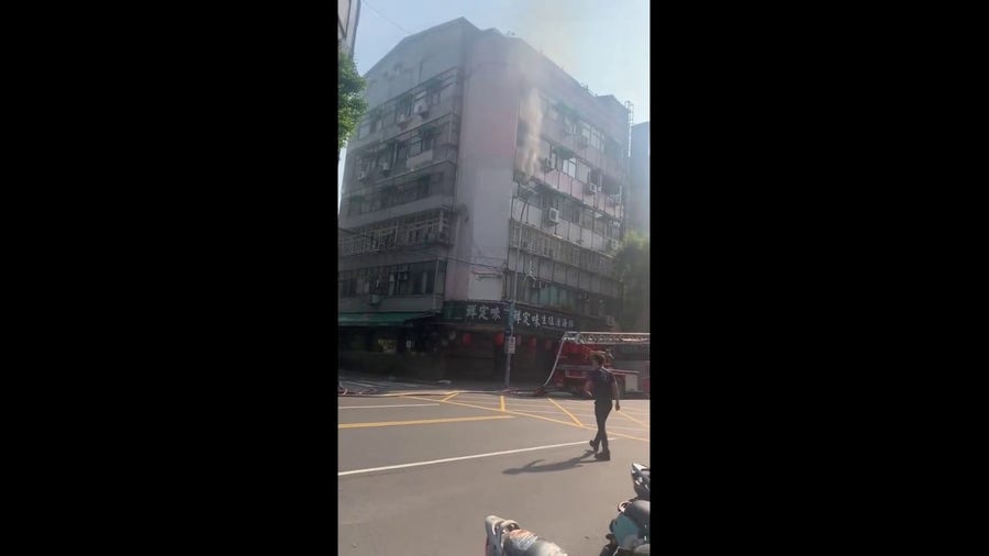 Watch: Smoke billows from building damaged by powerful earthquake in Taiwan