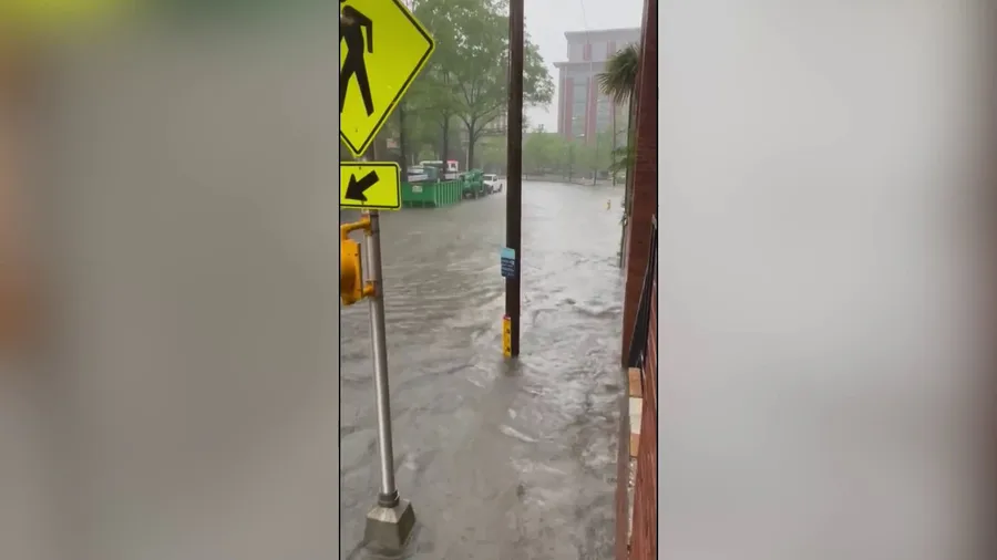 Car drives through floodwater in Charleston, South Carolina