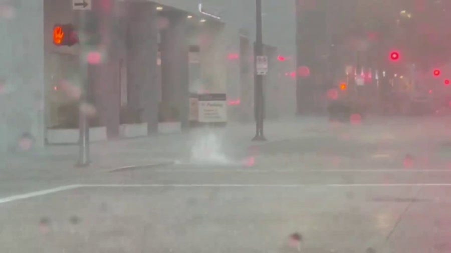 Houston manhole cover challenged by torrential rainfall