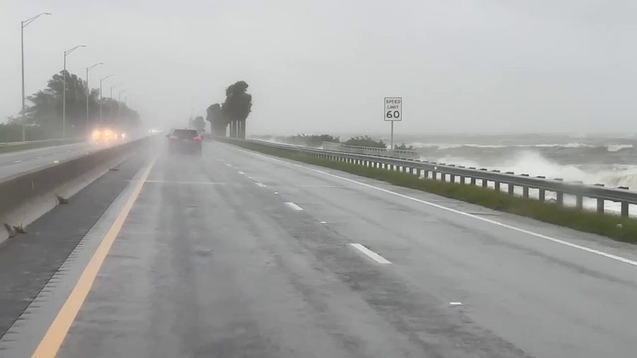 Waves slam onto Tampa Bay shore as Debby heads toward Florida