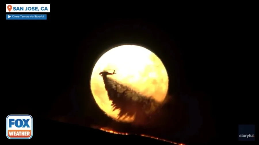 Supermoon rises as aircraft battles raging wildfire in San Jose, California