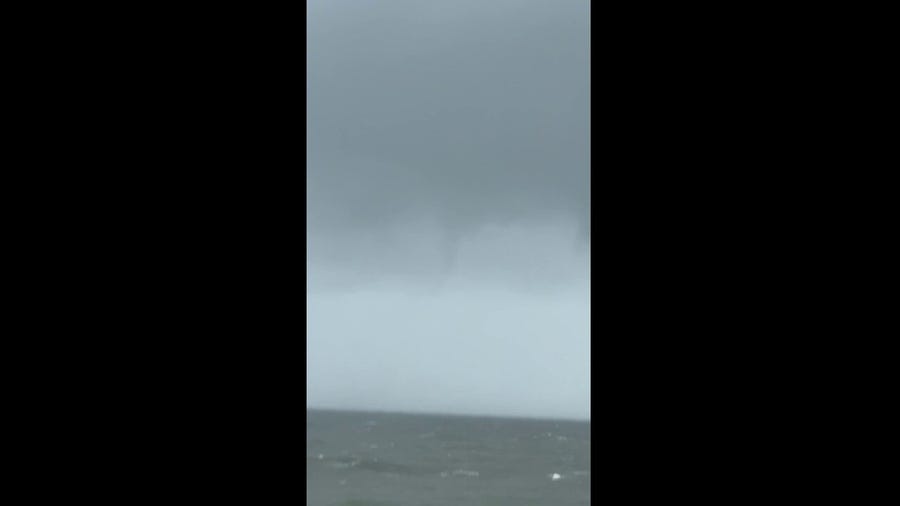 Apparent waterspout forms over ocean at North Carolina beach