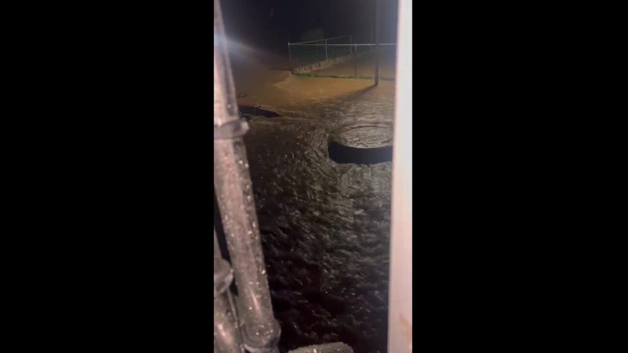 'There's nothing for me to do': Video shows woman, dog trapped by flooding in North Carolina