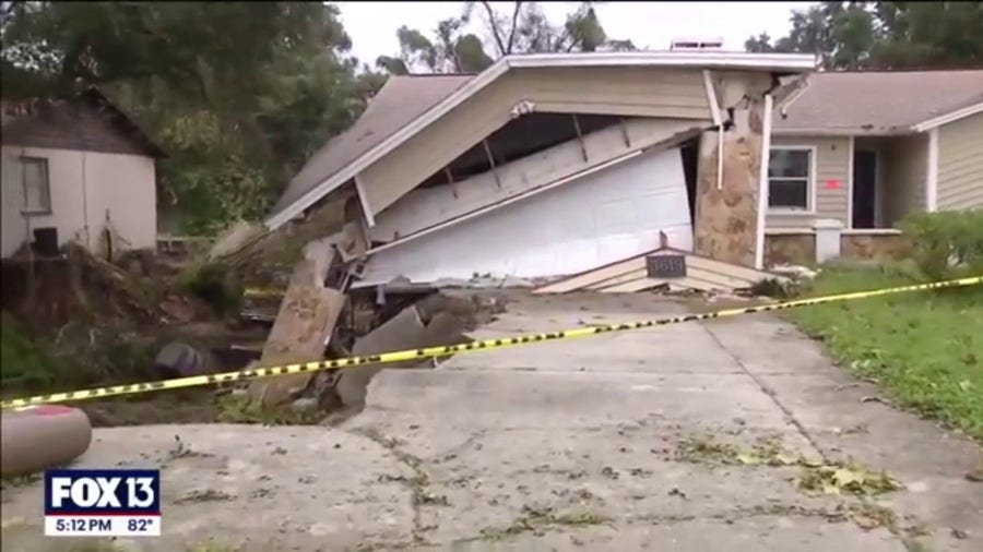 Massive hole swallows parts of homes in Florida