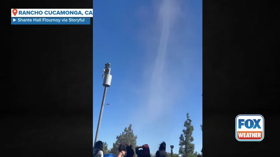 Dust devil sends youth football team ducking for cover