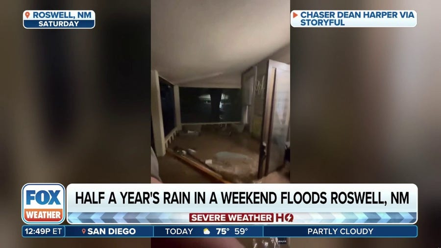 Half a year's worth of rain in a weekend strands New Mexico family on porch as Roswell home turns to river