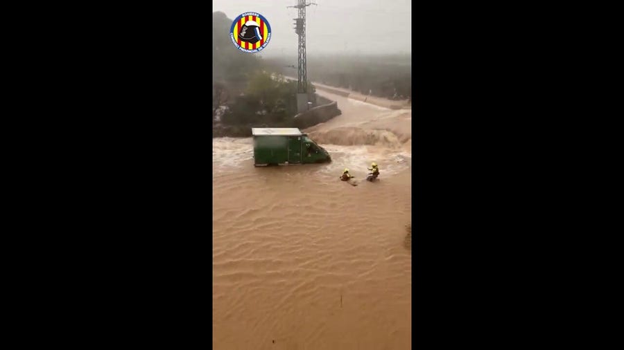 Watch: Stranded drivers rescued as deadly flooding hits Spain