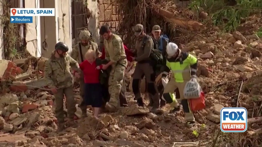 Watch: Elderly couple rescued in devastated town of Letur in eastern Spain following floods