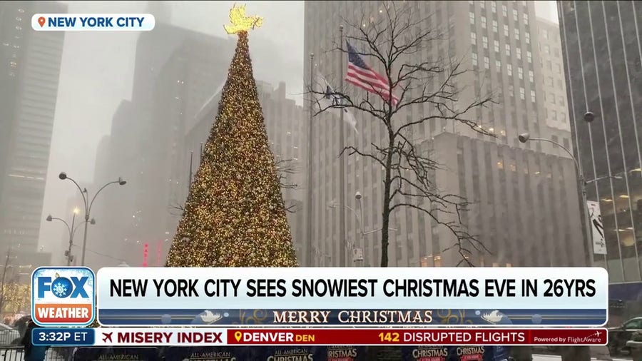 Light snow falls in New York City on Christmas Eve