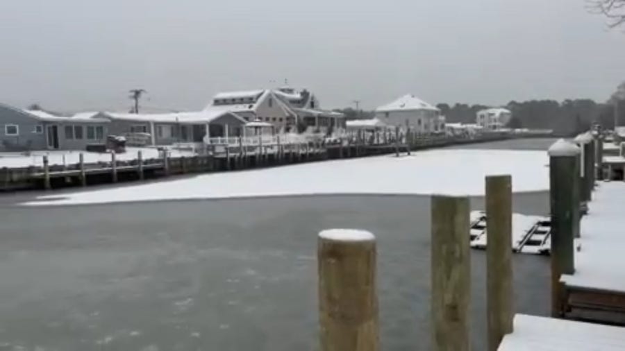 Snow coats the frozen lagoon in Waretown, NJ