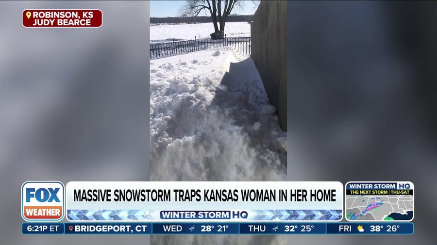 Snowdrift traps Kansas resident in her home