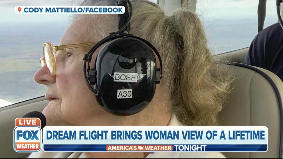 An 84-year-old former pilot got to check an item off her bucket-list when she took the controls during a flight over the fall colors in New Hampshire.