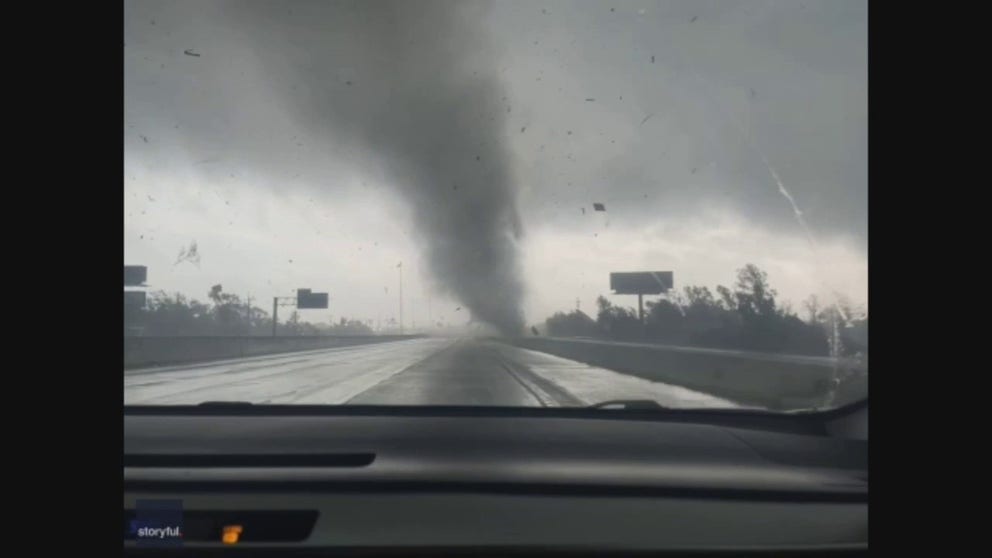 A tornado ripped across Interstate 10 in Orange, Texas, on Oct. 27. Mary Phan recorded this video and posted it to Facebook. She was driving at the time when she saw debris fly through the air and power lines snap. She then saw the tornado.