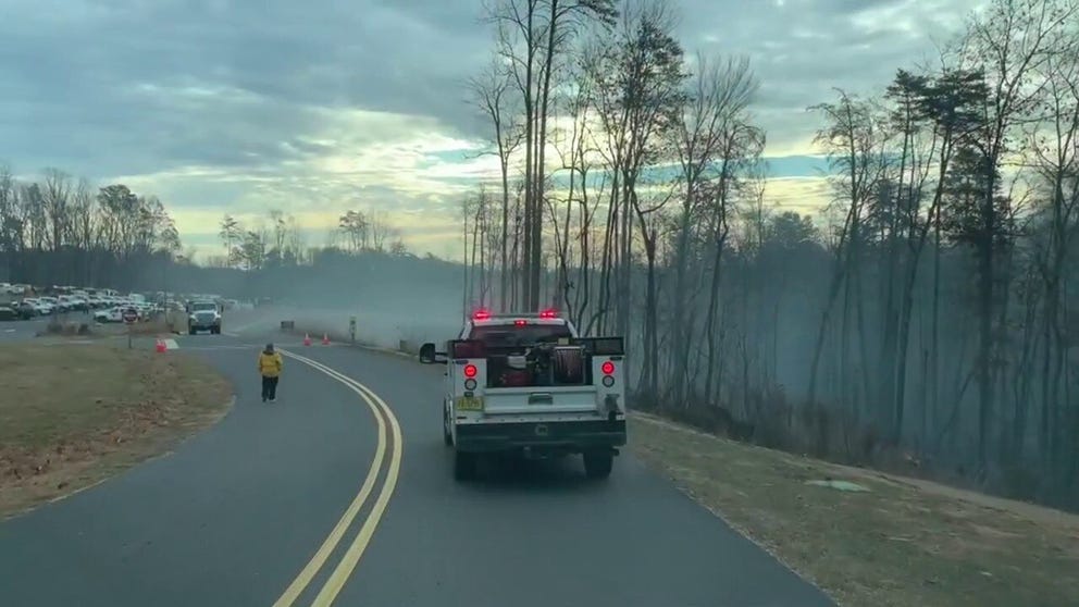 Crews are still working to extinguish a large wildfire that started on Pilot Mountain in North Carolina on Saturday.