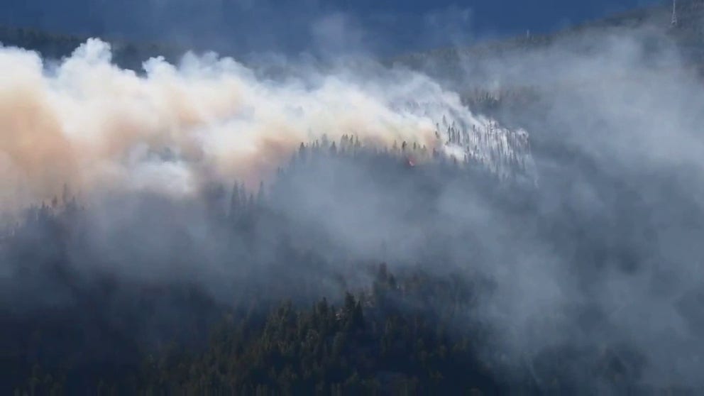 Smoke fills the air after the Miner's Candle Fire broke out near Idaho Springs, Colorado on Sunday. 