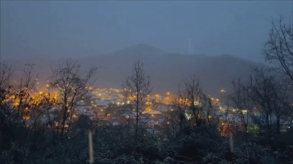 Snow falling Tuesday over Williamson, West Virginia