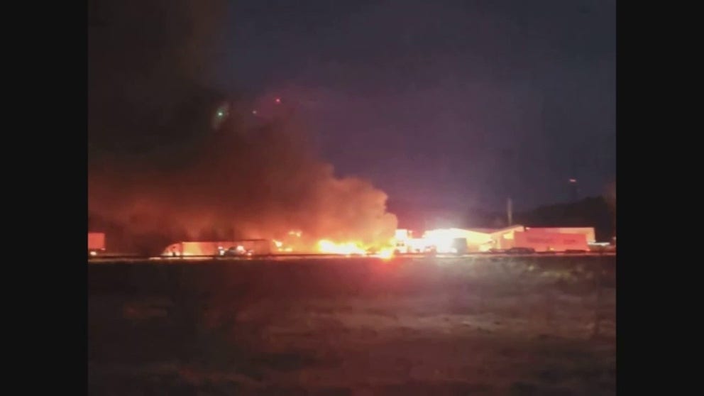 A fire broke out after semi-trucks were involved in a 'massive crash' on an icy Wisconsin interstate. 