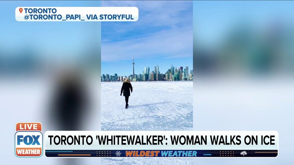 Video captures a woman walking on a frozen Lake Ontario headed for the city of Toronto. 