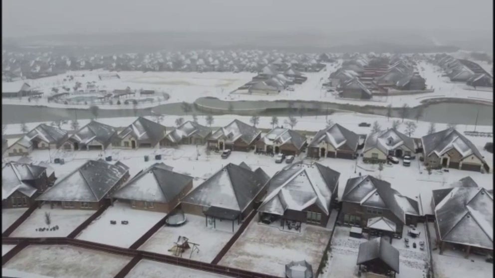 Snow and sleet fell across the Dallas-Fort Worth area on Thursday making roads in northern Texas treacherous. Drone footage captured by Matt Lantz shows snow-capped homes in Parker County.