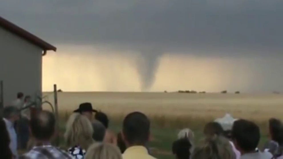 Caleb and Candra Pence held an outdoor wedding on May 19, 2012, in Harper, Kansas. Their ceremony had the perfect Midwest backdrop of wheat, cowboy hats and tornadoes. A significant tornado outbreak occurred across portions of Kingman and Harper counties that day. In all, nine tornadoes touched down -- the strongest being an EF-3.