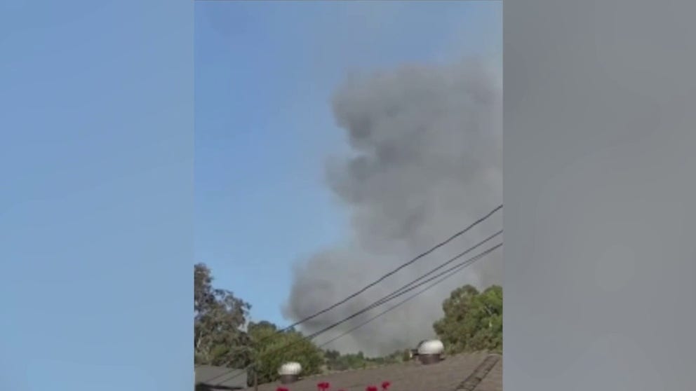 Video captured by a Whittier, California resident shows dark smoke spreading from a brush fire. At least two homes have been burned according to local officials. (Video: @sowhittier via Storyful)