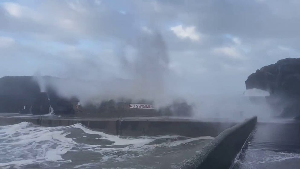 Powerful waves battered the Seafront in Portstewart, Ireland Monday. Waist-high sea foam covered the beach.
