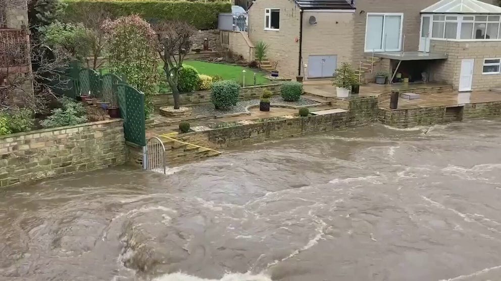 Floodwaters came up quickly on the Rive Aire in Leeds, England threatening homes.