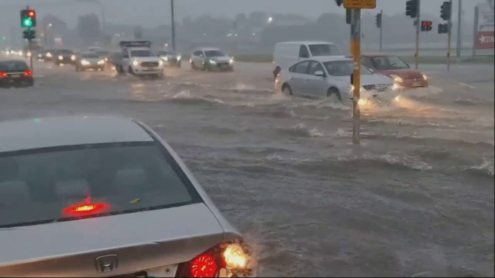 Thunderstorms dropped inches of rain in just hours across New South Wales. Cars during rush hour had to wade through foot deep water on the Central Coast Highway in West Gosford, Australia.