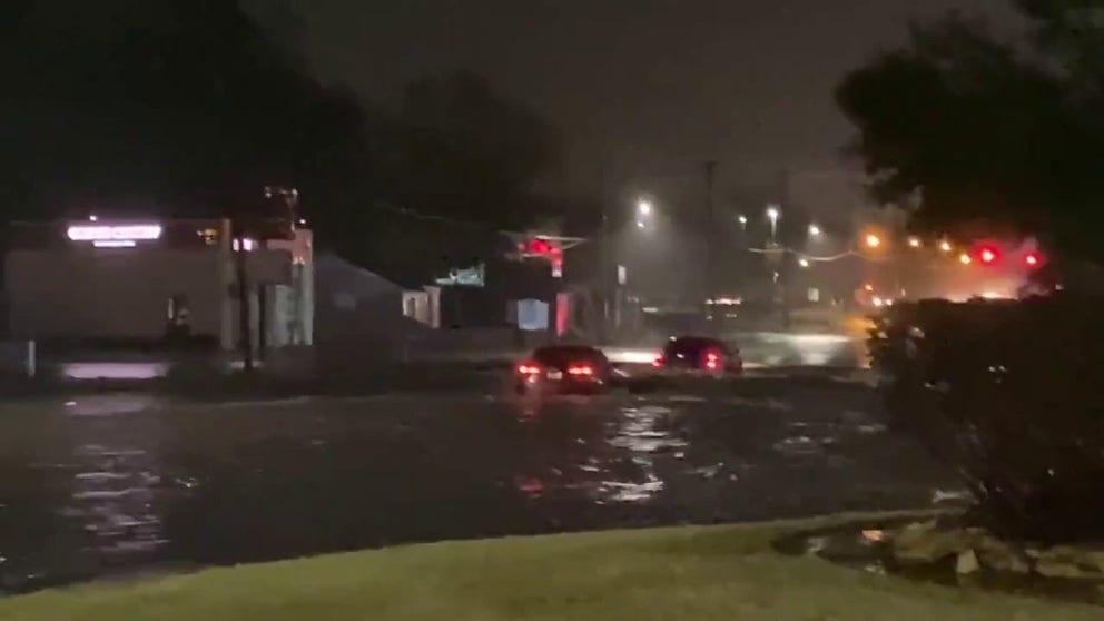 Flash flooding is seen in Lufkin, Texas, on Monday after severe storms rolled through the area. 